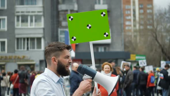 Man at Political Meeting with Banner with Points for Tracking To Copy Space Text