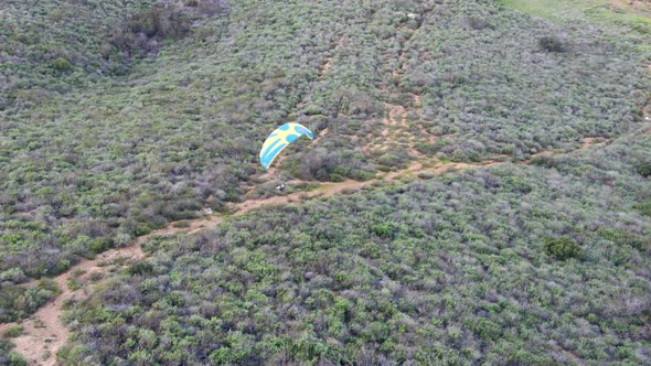 Para-glider Over the Top of the Mountain During Summer Sunny Day