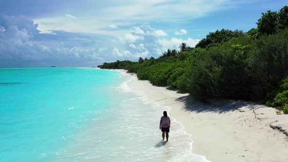 One girl enjoys life on tranquil seashore beach lifestyle by blue ocean with white sand background o