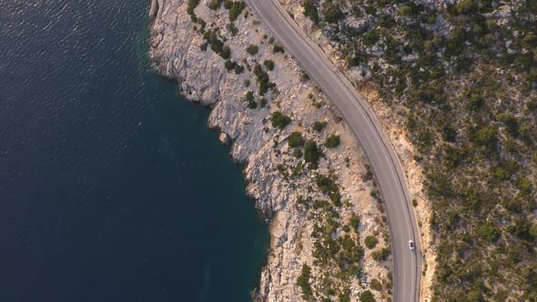 Aerial Drone View of Mountain Road Near the Turquoise Sea in Summer