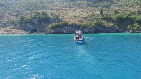 Tour boat next to shore in Albania