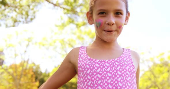 Cute girl smiling in park alt