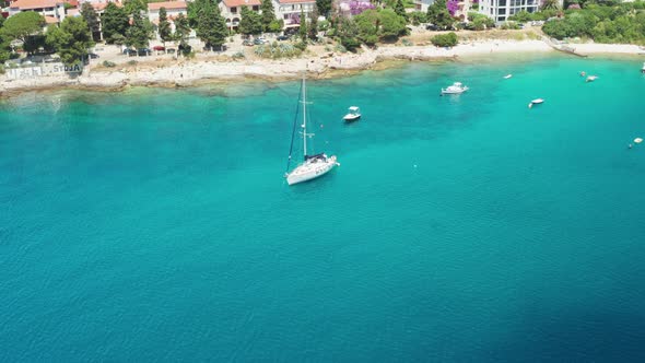 Yacht and Watercraft Drift Near Hotel Buildings at Resort