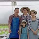 portrait of an Asian organic vegetable farmer family is standing and smiling confident in the qualit - VideoHive Item for Sale