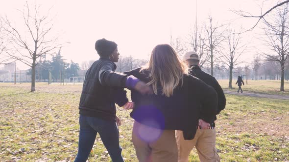 Slow motion shot of three friends walking in a park