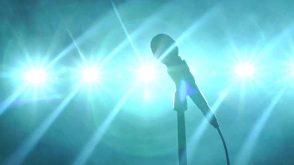 Closeup of Microphone on Stage Against the Background of Concert Lighting