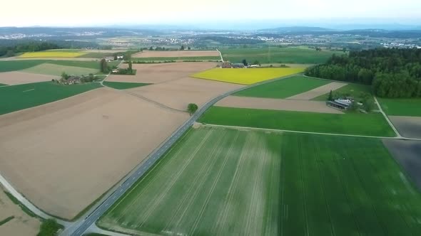 Aerial video of farms in the Swiss countryside in Bachs, Switzerland