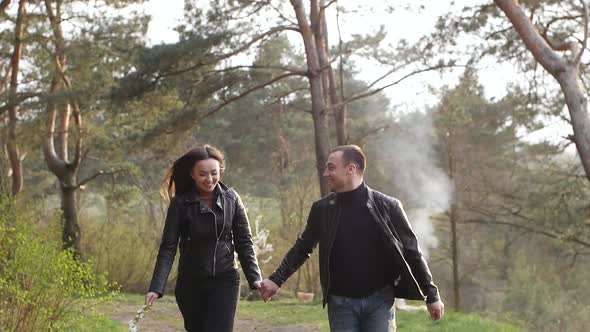 Young Couple Having Fun on Picnic in the Park