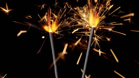 Bengal Fires New Year Sparkler Candles Sparkling Lights Burning on a Black Background Slow Motion
