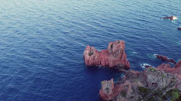 A beautiful aerial landscape of the coast of France and the Golden Island at sunset