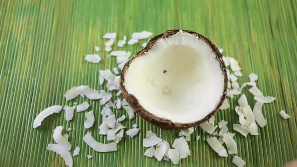Fresh opened coconut on a wood background