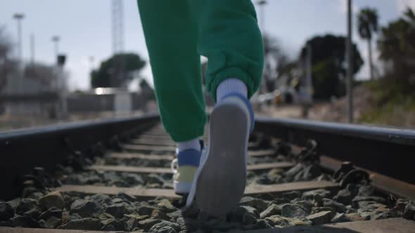 a Teenager on the Railway Tracks