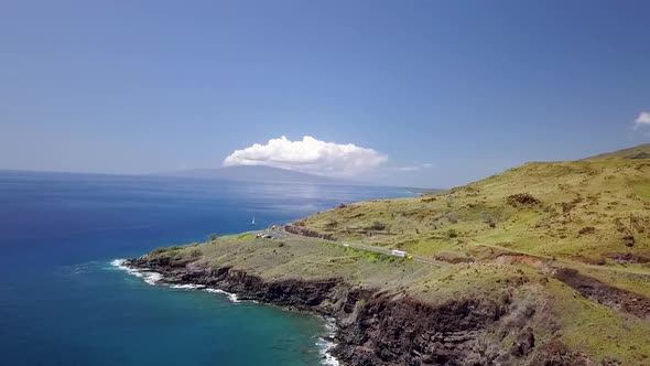 Drone over Hawaiian island coast line with cliffs