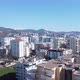 Aerial View of the New City and New Buildings Behind the City and the Blue Sky, Resort Town - VideoHive Item for Sale