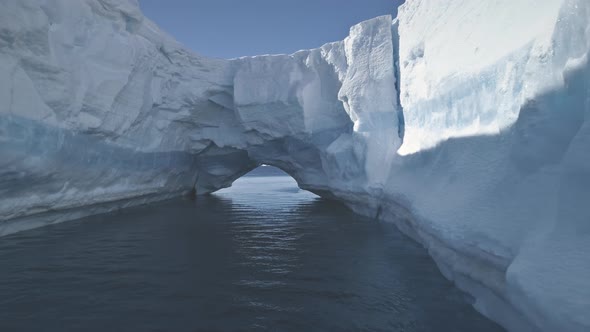 Aerial Drone Flight To Antarctica Iceberg Arch.