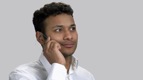 Young Darkskinned Hindu Guy Listening To Someone on Phone