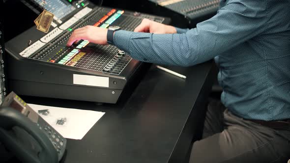 Recording Studio Sound Engineer Moving Sliders In Radio Station.Soundboard Pads Key On TV Station.