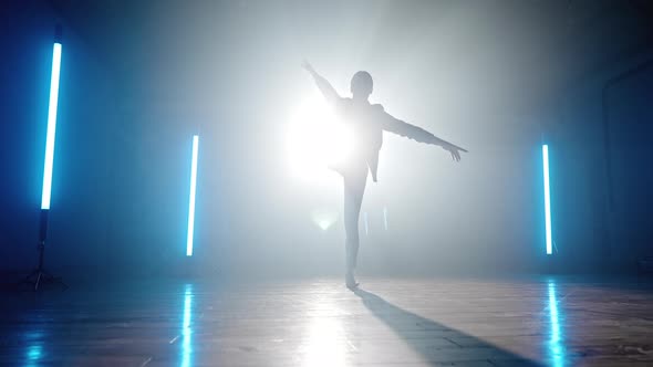 Silhouette of Contemporary Dancer Woman on Spotlight Background