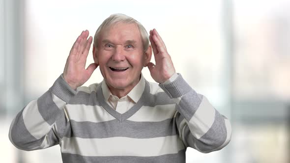 Happy Older Man Cheering for Sport Team.