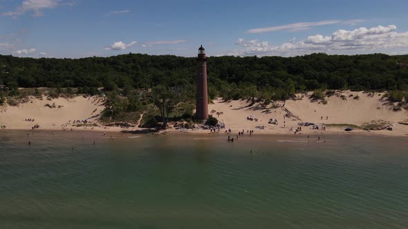 4k drone video of Little Sable Lighthouse in Silver Lake, Michigan in the summer.