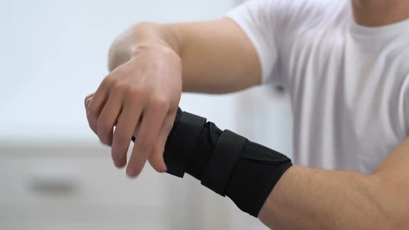 Man Wearing Titan Wrist Support, Joint Health Problems, Inflammation, Close-Up