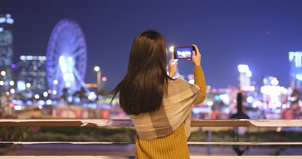 Asian woman use of smart phone at night