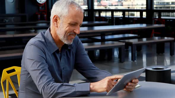 Businessman using digital tablet in hotel