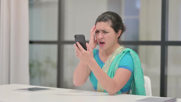 Upset Indian Woman Reacting to Loss on Smartphone