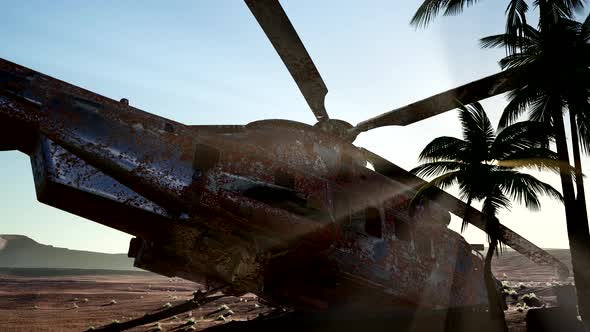 Old Rusted Military Helicopter in the Desert at Sunset