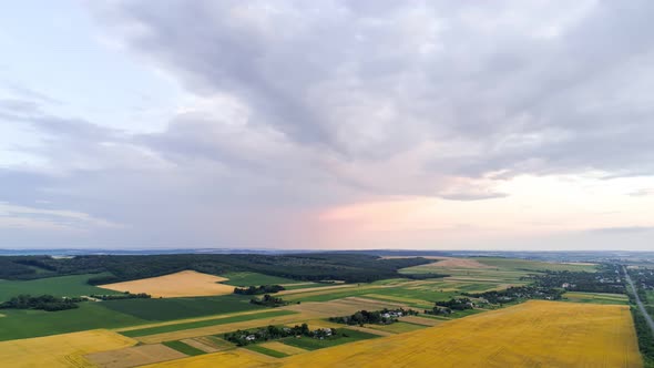 Aerial Flight Over  Field At Sunset 