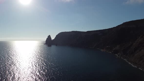 Aerial View From Above on Calm Azure Sea and Volcanic Rocky Shores