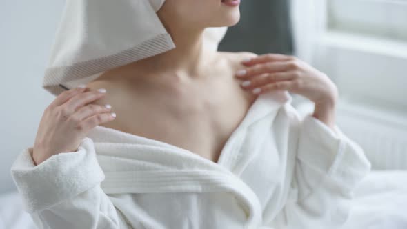 Young Woman in White Towel Chilling in Bedroom and Looking at Small Mirror Going to Do Beauty