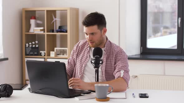 Happy Young Man with Laptop and Microphone at Home 20