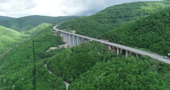 Aerial view of highway and beautiful natural landscape. Mountain bridge.