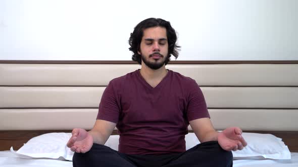 Indian ma doing mediation and yoga