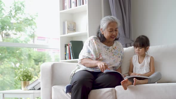 Elderly Asian Woman Teaching Her Granddaughter 07