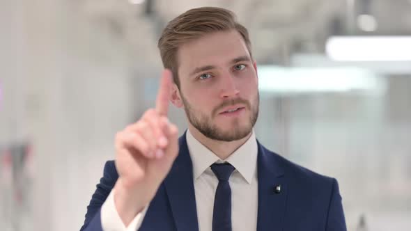 No Sign By Young Businessman By Finger Gesture