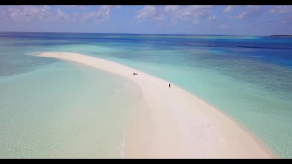 Aerial view sky of luxury seashore beach break by blue lagoon with white sand background of a dayout