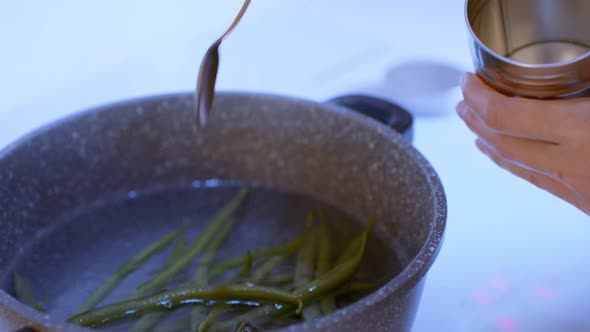 Cooking On The Stove. Green Beans In The Boiling Water, Salted.