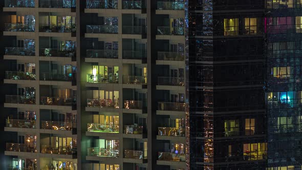 Windows of Apartment Building at Night Timelapse the Light From Illuminated Rooms of Houses