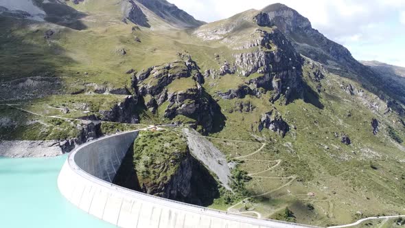 drone flight over the dam wall of the beautiful lac de moiry in the Swiss mountains, super landscape