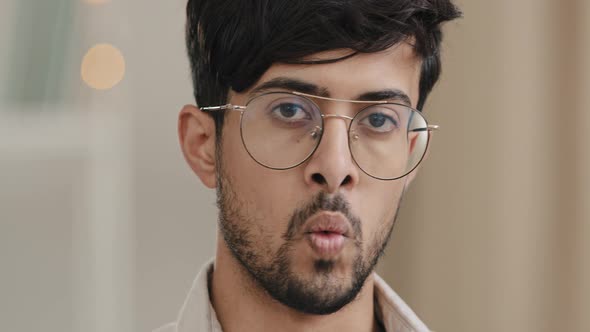 Closeup Male Dissatisfied Face Portrait Arabian Young Unshaven Man with Beard Wearing Glasses Waving