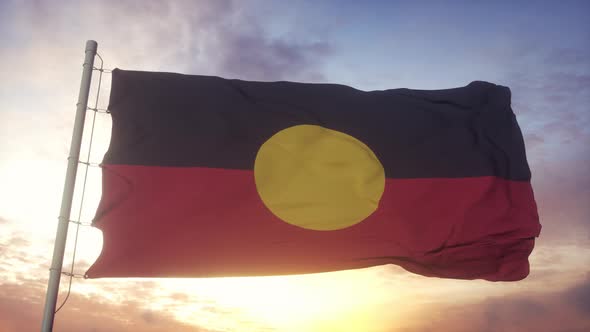 Australia Aboriginal Flag Waving in the Wind Sky and Sun Background