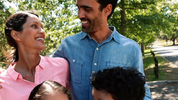 Happy family enjoying together in park