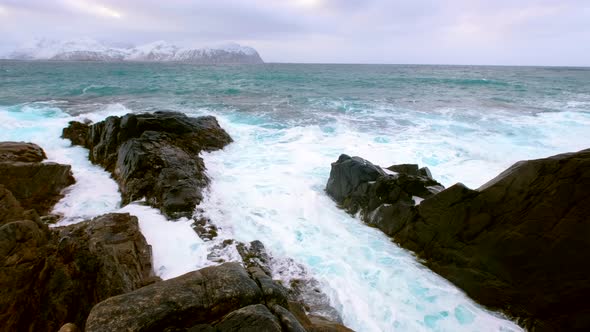 Norwegian Sea waves on rocky coast of Lofoten islands, Norway