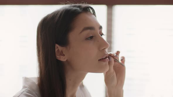 Woman Plucking Moustache Removing Hair Above Upper Lip In Bathroom