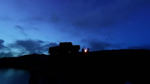 Couples Coming to Off-Road with a View of the Cliff and Burning Fire