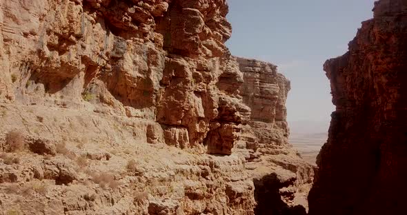 stone shadow valley in zagros mountain in Iran with birds and fields in background