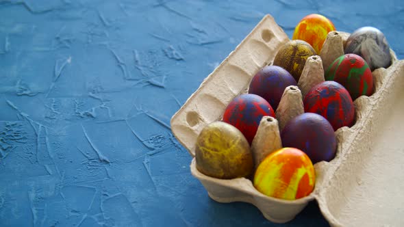 Colorful Easter Eggs on Blue Background. Easter Holiday Decorations Concept