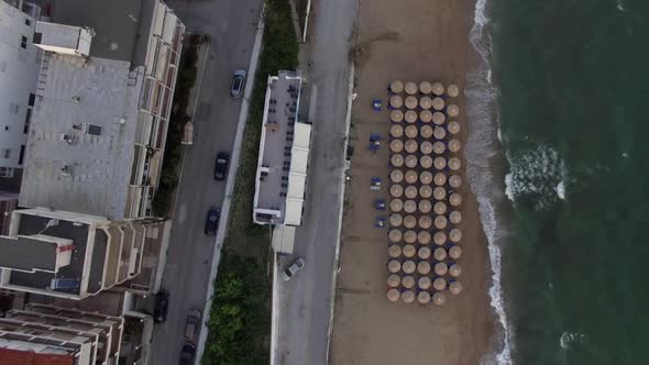  - Flying Over Town Waterfront with Beach and Houses Alongside, Greece